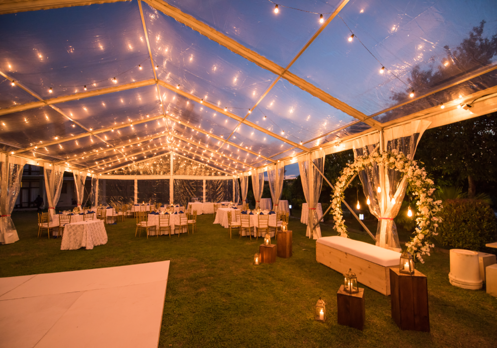 Outdoor wedding venue with string lights.