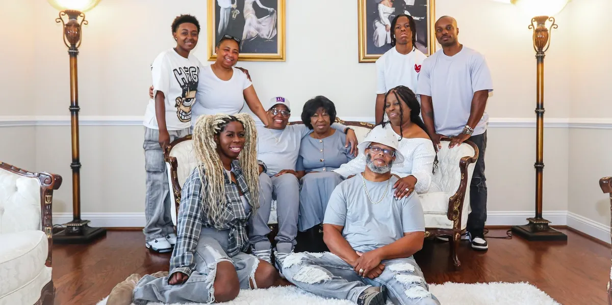 Family portrait in living room setting.